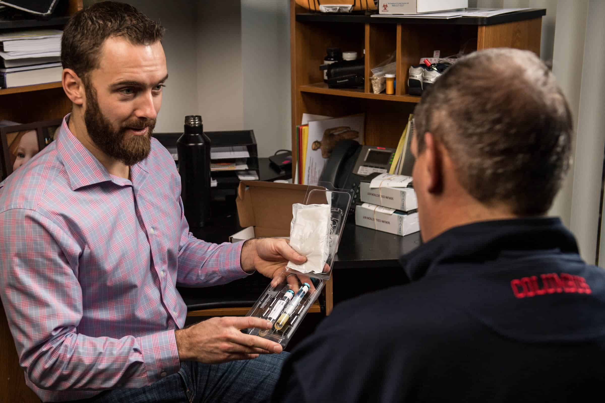 Erik Hensel reviewing medication with patient