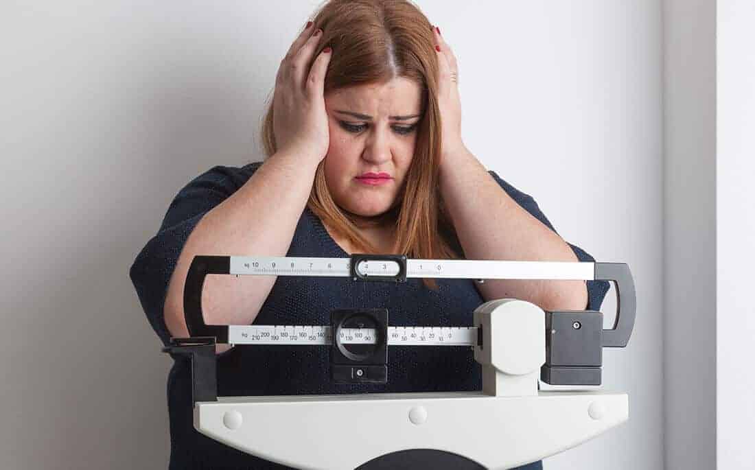 woman stressed out due to weight loss resistance