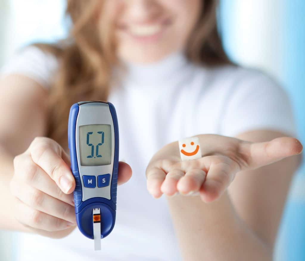 woman checking her diabetic reading